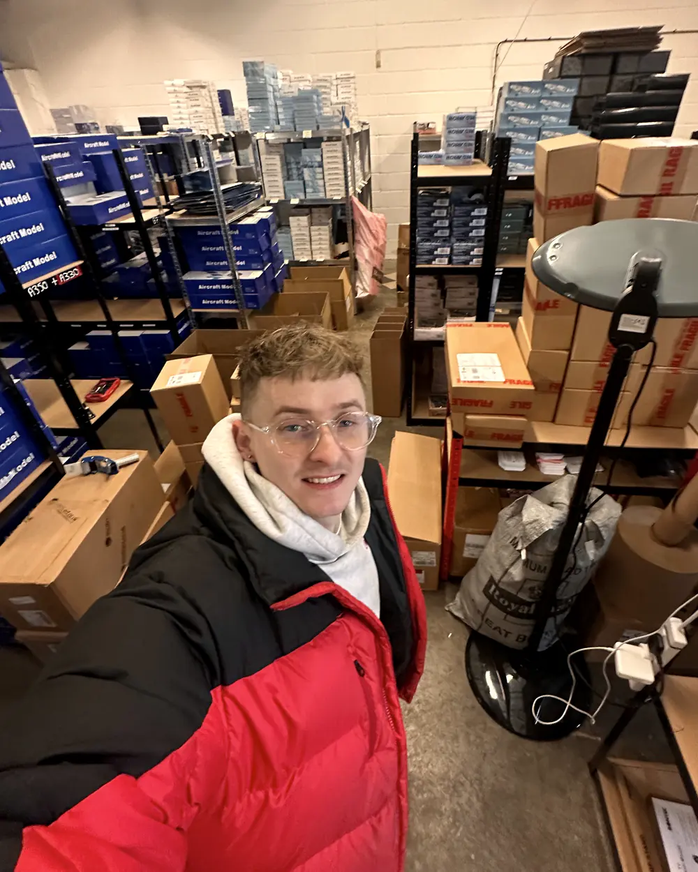Jordan Macintyre among the shelves of an ecommerce warehouse