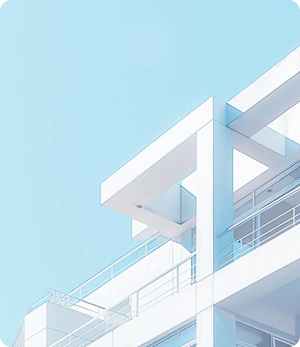 The white concrete lines of a modern building against a blue sky