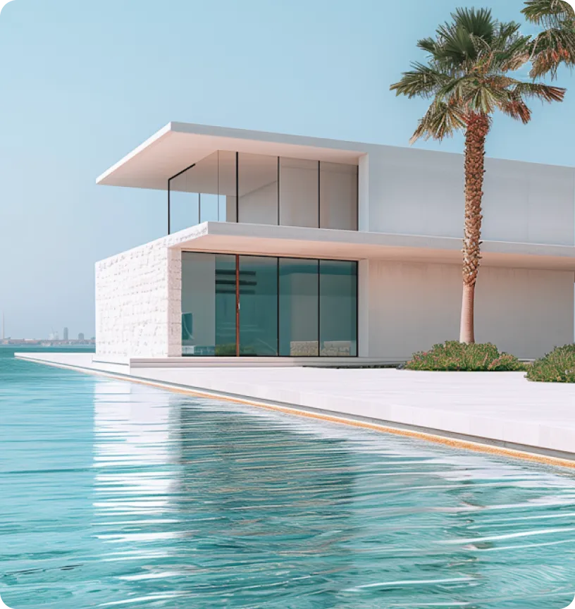 A white villa beside an infinity pool, palms and the sea behind