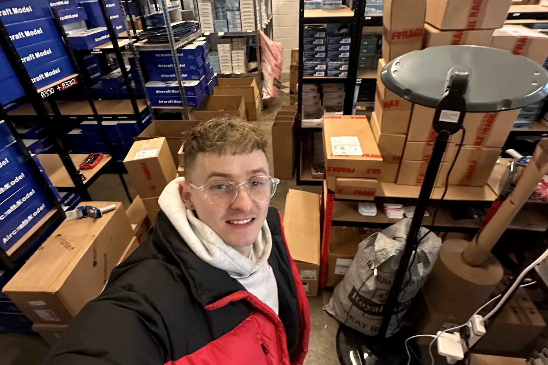Jordan Macintyre among the shelves of an ecommerce warehouse